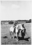 A Jewish refugee child is led around on a horse on her family's farm near Limuru, Kenya (Kiambu district), where they found refuge during World War II.