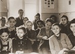 A classroom of students listens to a lecture in Yiddish by their teacher Chaim Szmerick in the Stuttgart DP camp.