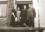 Members of the Berland family on the unfinished balcony of their home in Chelm.