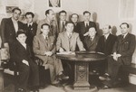 Group portrait of the members of the Stuttgart DP camp committee in their office.