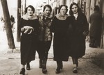 Four Jewish classmates walk along Lubelska Street in Chelm.