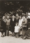 Sara and Abraham Berland (left) pose with friends in a park in Chelm.
