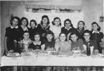 Group portrait of Jewish girls at Ida Wallach's birthday party in the Ulm displaced persons camp.