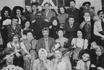 Group portrait of Jewish youth dressed in Purim costumes at the Fort Ontario refugee shelter.