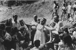 An unidentified teenage girl sings in an outdoor performance at the Ulm displaced persons camp.