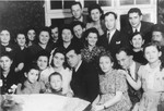 Group portrait of family and friends at the first wedding in the Ulm displaced persons camp.