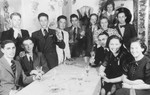 A group of young Jewish refugees raises their glasses in a toast on board the MS St.