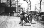German Jewish refugee Werner Lenneberg roller skates on the deck of the MS St.