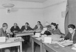 Jewish displaced persons work in the Zeilsheim camp offices.
