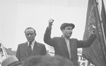 Ephraim Londner raises clenched fists during his speech at a demonstration protesting the return of the Exodus 1947 passengers to Germany at the Bergen-Belsen displaced persons camp.