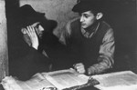 Students study Talmud at a Yeshiva in the Zeilsheim displaced person's camp.