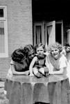 A group of young German Jewish refugee girls pose outside on a terrace in Amsterdam.