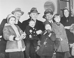 Group portrait of Henry Morgenthau with German-Jewish immigrant children upon their arrival in New York aboard the S.S.