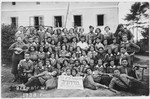Group portrait of members of the Gordonia Zionist youth movement at a summer camp in Slawniow, Poland.