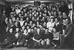 Group portrait of members of the Kibbutz Buchenwald hachshara (Zionist collective) in Geringshof, Germany, taken on the occasion of the marriage of four of its couples.