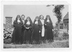 Ursula Klipstein and her mother pose with Sisters Catherine, Odile, Elisabette and Huberte at the Soeurs de Sainte Marie convent near Braine-l'Alleud, where Ursula was hidden during the war.