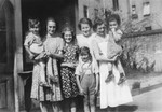 Group portrait of women and children at the Jewish Kinderheim [children's home] located at Fehrbelliner Strasse 92 in Berlin.