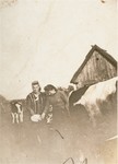 Irka Cymerman (right), a Polish Jew in hiding, feeds the cows on a farm in Sadolesie (near Malkinia).