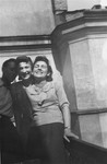 Polish rescuer Wladyslaw Wojcik poses with Irka and Henia Cymerman on the balcony of their apartment in the Warsaw ghetto.