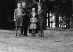 Dorota Fischbein poses with members of the Koszarski family who sheltered her during the war.