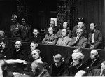 The defendants sit in the dock at the Einsatzgruppen Trial.