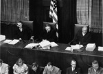 The judges of Military Tribunal II-A, listen to the Einsatzgruppen Trial.