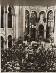Rabbi Judah Nadich, chief Jewish chaplain for the American army in Europe, delivers a speech to French civilians and Jewish soldiers at the rue de la Victoire synagogue in Paris.