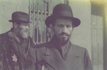 Close-up portrait of two bearded Jewish men in the Lodz ghetto.