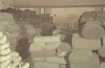 Rolls of fabric are stored in a warehouse in the Lodz ghetto.