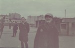 Hans Biebow, German head of the Lodz ghetto administration, observing an elderly and destitute Jew in the ghetto.