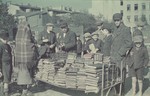 Booksellers in the Lodz ghetto.

Original German caption: "Strassenbild" (street scene), #186.