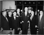 U.S. Ambassador to Israel James G. McDonald (center), poses with a group of men at a State of Israel bonds drive at a synagogue in the U.S.