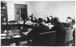 James McDonald converses with committee members at a hearing conducted by the Anglo-American Committee of Inquiry on Palestine at the YMCA building in Jerusalem.