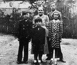 Pictured here is Cesia Carol Uncyk, her three brothers, and their Polish nanny.