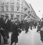 Jews on the street at a major intersection in the Warsaw ghetto.