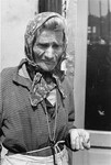 Portrait of an elderly Jewish woman wearing a head scarf in the Warsaw ghetto.