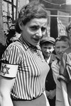 Portrait of a woman wearing a striped blouse and an armband in the Warsaw ghetto.