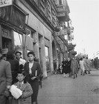Jews on the street in the Warsaw ghetto.  

Joest's caption reads: "When I see my own photos again after so many years, I ask myself which of these people survived, who at that time I photographed as normal pedestrians on a large street."
