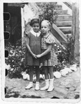 Two Jewish cousins pose outside in Bilki.

Pictured are Magdalena Mermelstein (left) and her cousin Kreola Roth.