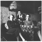 Three Jewish women seated in a living room in Osijek, Croatia.