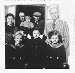 Group portrait of members of a Jewish family outside their home in Bilki.