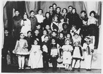 Group portrait of children from the Jewish school in Osijek, Croatia dressed in costume for Purim.