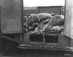 A railroad car containing the bodies of prisoners who died while on an evacuation transport presumably headed for Dachau concentration camp.