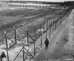 American soldiers patrol the perimeter of the newly liberated Woebbelin concentration camp.