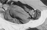 The corpse of a man in Woebbelin who died of starvation prior to the liberation of the camp.