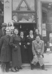 A group of young Greek Jews poses in front of a tobacco store in Salonika.