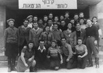 Group portrait of members of the Ghetto Fighters kibbutz hachshara [Zionist collective] at the Eschwege displaced persons camp.