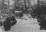Priests conduct Easter mass for a group of nuns and children at a convent school in Lomna, Poland which sheltered Jewish children during the German occupation.