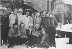 Group portrait of school girls on a winter outing.