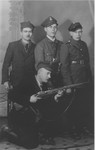 Jewish survivor, Wolf Laudon, poses with members of his Polish military police unit.